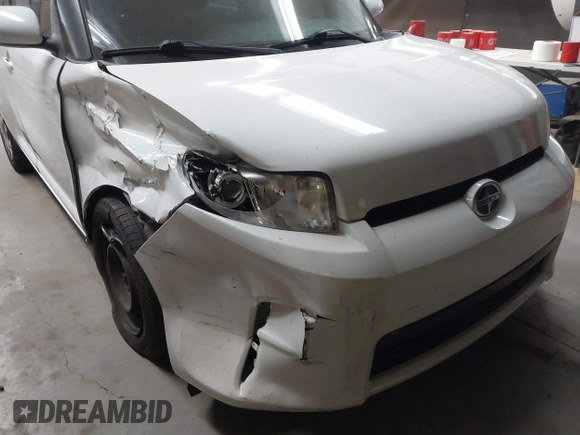 2014 Scion xB with VIN JTLZE4FE1EJ060281, listed as a IAAI auction lot 41477386 with 61,423 mi miles. Bid and sale history available at carsss.com. Image 6.