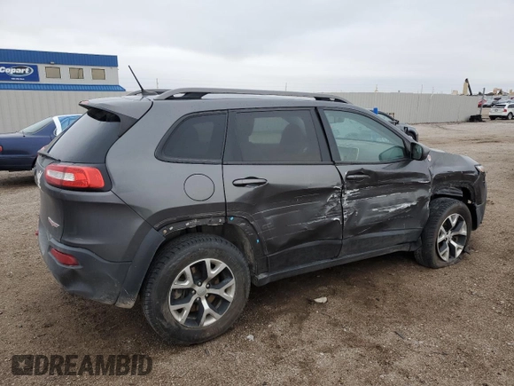 2015 Jeep Cherokee Trailhawk with VIN 1C4PJMBB6FW574108, listed as a Copart auction lot 57798475 with 105,022 mi miles and Salvage title. Bid and sale history available at DreamBid. Image 3.