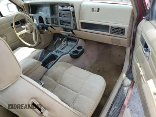 1992 Jeep Cherokee z VIN 1J4FJ27S0NL216957, wystawiony jako Copart lot #52689055 z przebiegiem 226 581 mil mil oraz Szkoda całkowita • Salvage title. Historia ofert i sprzedaży dostępna na DreamBid. Obrazek 10.