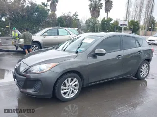 2012 Mazda Mazda3 i Touring with VIN JM1BL1L82C1587372, listed as a IAAI auction lot 41806633 with 145,073 mi miles. Bid and sale history available at carsss.com. Image 2.