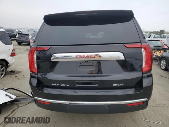 2023 GMC Yukon XL SLT with VIN 1GKS2GKD5PR363433, listed as a Copart auction lot 85979734 with 61,957 mi miles and Salvage Title. Bid and sale history available at DreamBid. Image 6.