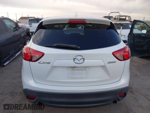 2014 Mazda CX-5 Touring with VIN JM3KE2CY8E0321578, listed as a IAAI auction lot 41769930 with 101,724 mi miles. Bid and sale history available at carsss.com. Image 16.