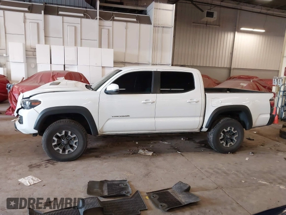 2021 Toyota Tacoma SR z VIN 5TFCZ5AN1MX268370, wystawiony jako IAAI lot #41922632 z przebiegiem 50 358 mil mil oraz . Historia ofert i sprzedaży dostępna na DreamBid. Obrazek 14.