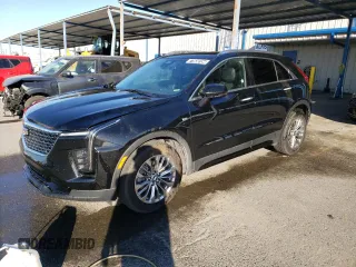 2024 Cadillac XT4 AWD Premium Luxury with VIN 1GYFZDR49RF128402, listed as a Copart auction lot 77630154 with 20,673 mi miles and Salvage Title. Bid and sale history available at carsss.com. Image 1.