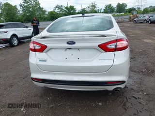 2016 Ford Fusion Titanium with VIN 3FA6P0SU5GR287017, listed as a IAAI auction lot 42316622 with 97,000 mi miles and . Bid and sale history available at DreamBid. Image 16.