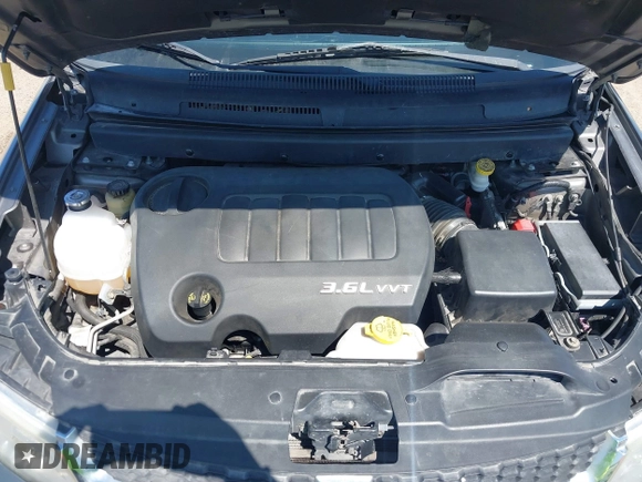 2013 Dodge Journey SXT with VIN 3C4PDDBGXDT650886, listed as a IAAI auction lot 41864331 with 224,579 mi miles and . Bid and sale history available at DreamBid. Image 10.