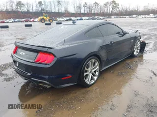 2021 Ford Mustang GT z VIN 1FA6P8CF5M5138913, wystawiony jako IAAI lot #41821447 z przebiegiem 26 365 mil mil oraz . Historia ofert i sprzedaży dostępna na DreamBid. Obrazek 4.