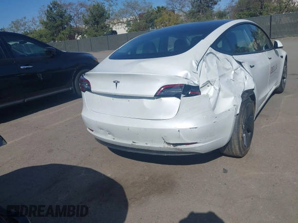 2022 Tesla Model 3 with VIN 5YJ3E1EA2NF245817, listed as a IAAI auction lot 41976493 with 32,710 mi miles and . Bid and sale history available at DreamBid. Image 6.
