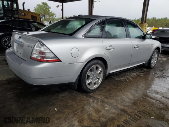 2009 Ford Taurus Limited with VIN 1FAHP25W09G100990, listed as a Copart auction lot 80745234 with 129,692 mi miles and Salvage Title. Bid and sale history available at carsss.com. Image 3.