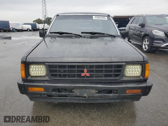 1991 Mitsubishi Mighty Max z VIN JA7FL25W7MP028365, wystawiony jako Copart lot #43964285 z przebiegiem 175 102 mil mil oraz Szkody całkowita. Historia ofert i sprzedaży dostępna na DreamBid. Obrazek 5.