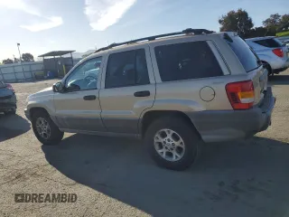 1999 Jeep Grand Cherokee Laredo z VIN 1J4GW58NXXC704719, wystawiony jako Copart lot #49546395 z przebiegiem 276 716 mil mil oraz Czysty tytuł • Clean title. Historia ofert i sprzedaży dostępna na DreamBid. Obrazek 2.