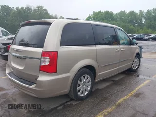 2014 Chrysler Town & Country Touring with VIN 2C4RC1BG7ER208937, listed as a IAAI auction lot 42213347 with 198,077 mi miles and . Bid and sale history available at DreamBid. Image 4.