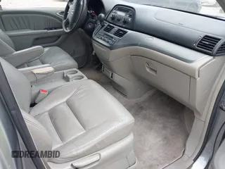 2005 Honda Odyssey EX-L z VIN 5FNRL386X5B038143, wystawiony jako IAAI lot #42149398 z przebiegiem 243 002 mil mil oraz . Historia ofert i sprzedaży dostępna na DreamBid. Obrazek 5.