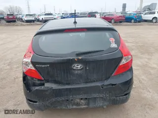 2014 Hyundai Accent GS with VIN KMHCT5AE6EU197814, listed as a IAAI auction lot 41697539 with 228,490 mi miles. Bid and sale history available at carsss.com. Image 6.