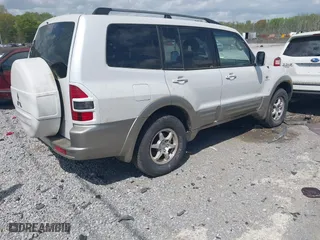 2002 Mitsubishi Montero LTD with VIN JA4MW51RX2J004459, listed as a IAAI auction lot 41963113 with 212,764 mi miles. Bid and sale history available at carsss.com. Image 4.