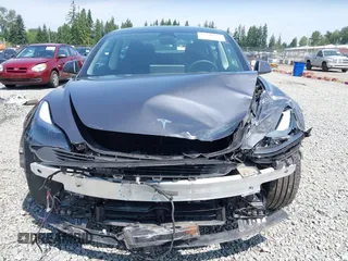 2023 Tesla Model 3 with VIN 5YJ3E1EA6PF664045, listed as a IAAI auction lot 42561039 with 18,708 mi miles and . Bid and sale history available at DreamBid. Image 13.