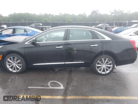 2013 Cadillac XTS Premium z VIN 2G61S5S39D9112491, wystawiony jako IAAI lot #42216373 z przebiegiem 145 338 mil mil oraz . Historia ofert i sprzedaży dostępna na DreamBid. Obrazek 14.