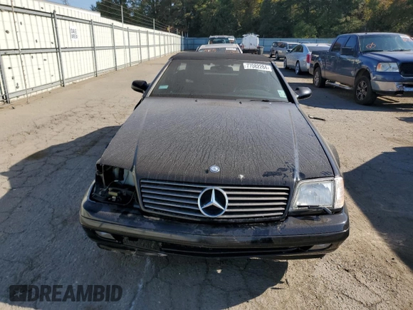 1999 Mercedes-Benz SL-Class with VIN WDBFA68F1XF184891, listed as a Copart auction lot 77082284 with 96,379 mi miles and Salvage Title. Bid and sale history available at carsss.com. Image 5.