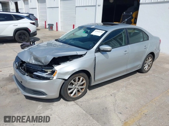 2012 Volkswagen Jetta Sedan SE w/Convenience with VIN 3VWDX7AJ1CM401939, listed as a IAAI auction lot 41941070 with 123,611 mi miles. Bid and sale history available at carsss.com. Image 2.