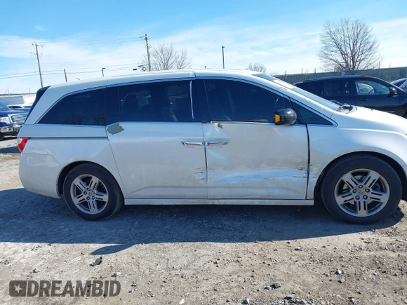 2012 Honda Odyssey Touring with VIN 5FNRL5H96CB010696, listed as a IAAI auction lot 41605868 with 109,411 mi miles and . Bid and sale history available at carsss.com. Image 13.