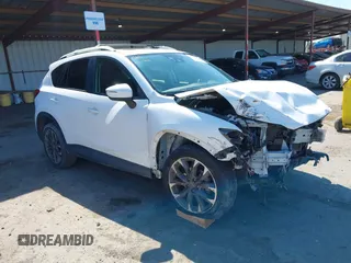 2016 Mazda CX-5 Grand Touring with VIN JM3KE4DY5G0678777, listed as a IAAI auction lot 41835420 with 141,095 mi miles and . Bid and sale history available at carsss.com. Image 1.