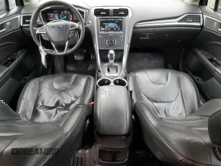 2014 Ford Fusion Titanium Hybrid z VIN 3FA6P0RU1ER118499, wystawiony jako Copart lot #58591305 z przebiegiem 252 353 mil mil oraz Szkody całkowita. Historia ofert i sprzedaży dostępna na DreamBid. Obrazek 8.