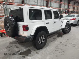 2021 Jeep Wrangler Unlimited Rubicon with VIN 1C4HJXFN2MW809904, listed as a IAAI auction lot 41567956 with 34,000 mi miles and . Bid and sale history available at DreamBid. Image 4.