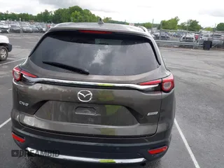 2016 Mazda CX-9 Grand Touring z VIN JM3TCADY6G0126391, wystawiony jako IAAI lot #42242541 z przebiegiem 45 147 mil mil oraz . Historia ofert i sprzedaży dostępna na DreamBid. Obrazek 16.