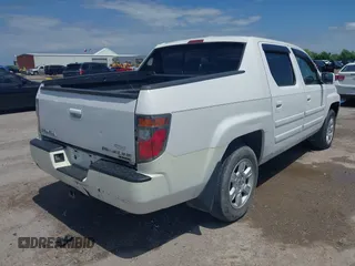 2007 Honda Ridgeline RTL z VIN 2HJYK16537H527957, wystawiony jako IAAI lot #42098143 z przebiegiem 233 163 mil mil oraz . Historia ofert i sprzedaży dostępna na DreamBid. Obrazek 4.
