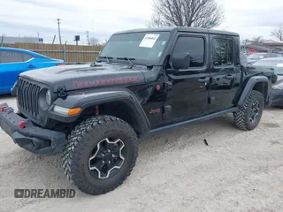 2022 Jeep Gladiator Rubicon with VIN 1C6JJTBG7NL145501, listed as a IAAI auction lot 41506842 with 20,593 mi miles and . Bid and sale history available at DreamBid. Image 2.