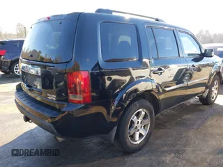 2010 Honda Pilot Touring with VIN 5FNYF4H95AB030531, listed as a IAAI auction lot 41441088 with 274,185 mi miles and . Bid and sale history available at carsss.com. Image 4.