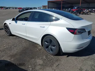 2020 Tesla Model 3 Standard Range Plus with VIN 5YJ3E1EA7LF797150, listed as a IAAI auction lot 41869088 with 75,708 mi miles and . Bid and sale history available at carsss.com. Image 3.