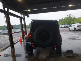 2021 Jeep Wrangler Unlimited Rubicon with VIN 1C4HJXFG4MW543254, listed as a IAAI auction lot 42316180 with 50,696 mi miles and . Bid and sale history available at DreamBid. Image 16.