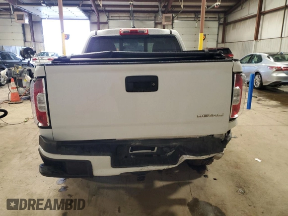2018 GMC Canyon 4WD Denali z VIN 1GTG6EEN6J1171037, wystawiony jako Copart lot #52521865 z przebiegiem 99 931 mil mil oraz Szkoda całkowita • Salvage title. Historia ofert i sprzedaży dostępna na DreamBid. Obrazek 6.
