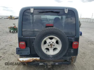 2000 Jeep Wrangler Sport z VIN 1J4FA49S9YP798353, wystawiony jako Copart lot #62009645 z przebiegiem 116 676 mil mil oraz Szkoda całkowita • Salvage title. Historia ofert i sprzedaży dostępna na DreamBid. Obrazek 6.