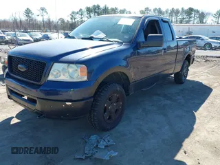 2006 Ford F-150 STX with VIN 1FTRX14W36NB57928, listed as a IAAI auction lot 41704722 with 145,855 mi miles. Bid and sale history available at carsss.com. Image 2.