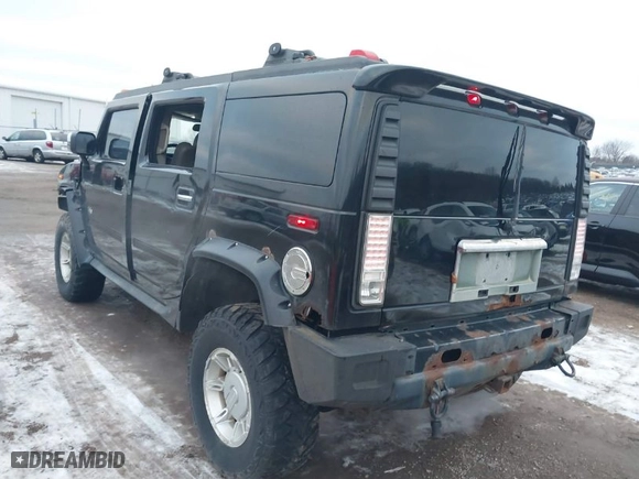 2003 Hummer H2 with VIN 5GRGN23UX3H106356, listed as a IAAI auction lot 41185603 with 1 mi miles. Bid and sale history available at carsss.com. Image 3.