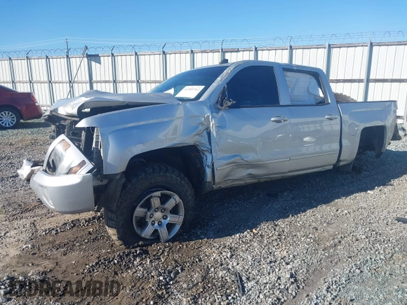 2016 Chevrolet Silverado 1500 LT with VIN 3GCUKREC0GG131034, listed as a IAAI auction lot 41289762 with 176,978 mi miles and . Bid and sale history available at DreamBid. Image 2.
