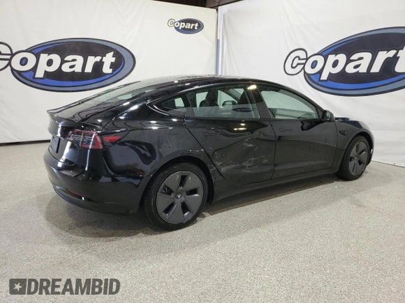 2023 Tesla Model 3 with VIN 5YJ3E1EA4PF452809, listed as a Copart auction lot 63688885 with 125,442 mi miles and Clean title. Bid and sale history available at DreamBid. Image 3.