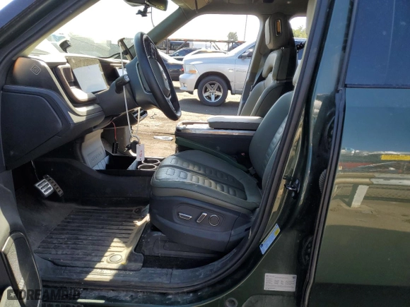 2023 Rivian R1S Launch Edition with VIN 7PDSGABL3PN000033, listed as a Copart auction lot 60131444 with 30,066 mi miles and Salvage Title. Bid and sale history available at carsss.com. Image 7.