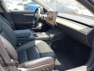 2023 Tesla Model 3 with VIN 5YJ3E1EA4PF400306, listed as a IAAI auction lot 42398603 with 18,551 mi miles and . Bid and sale history available at DreamBid. Image 5.