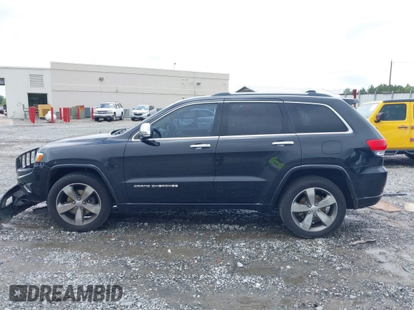 2015 Jeep Grand Cherokee Overland with VIN 1C4RJECG3FC152601, listed as a IAAI auction lot 42414340 with 139,315 mi miles and . Bid and sale history available at DreamBid. Image 14.
