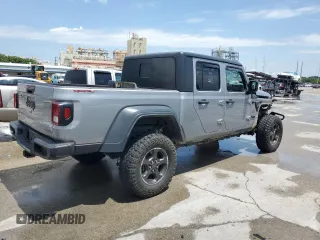 2020 Jeep Gladiator Sport S with VIN 1C6JJTAG9LL149872, listed as a Copart auction lot 58518095 with 118,910 mi miles and Salvage title. Bid and sale history available at DreamBid. Image 3.