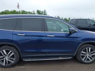 2017 Honda Pilot Touring with VIN 5FNYF6H99HB093136, listed as a IAAI auction lot 42507326 with 125,579 mi miles and . Bid and sale history available at DreamBid. Image 13.