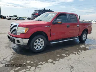 2011 Ford F-150 XLT with VIN 1FTFW1ET7BFC63815, listed as a Copart auction lot 62466015 with 199,386 mi miles and Salvage title. Bid and sale history available at DreamBid. Image 1.