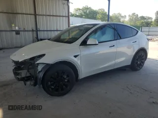 2023 Tesla Model Y Long Range z VIN 7SAYGDEE7PF614925, wystawiony jako Copart lot #53856395 z przebiegiem 67 182 mil mil oraz Szkoda całkowita • Salvage title. Historia ofert i sprzedaży dostępna na DreamBid. Obrazek 1.