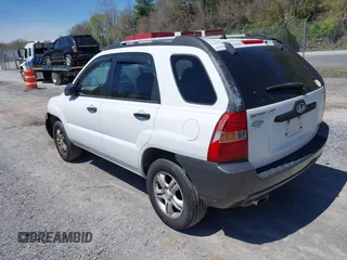 2006 Kia Sportage LX with VIN KNDJF723567151614, listed as a IAAI auction lot 42022102 with 128,564 mi miles and . Bid and sale history available at carsss.com. Image 3.