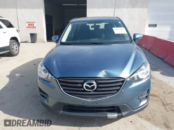 2016 Mazda CX-5 Sport with VIN JM3KE4BY0G0746034, listed as a IAAI auction lot 41842894 with 92,801 mi miles. Bid and sale history available at carsss.com. Image 12.