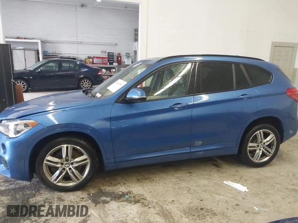2019 BMW X1 xDrive28i with VIN WBXHT3C53K5L36690, listed as a IAAI auction lot 42012992 with 70,339 mi miles. Bid and sale history available at carsss.com. Image 14.