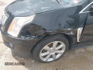 2015 Cadillac SRX Premium Collection with VIN 3GYFNGE30FS634363, listed as a IAAI auction lot 42672064 with 146,821 mi miles and . Bid and sale history available at DreamBid. Image 6.